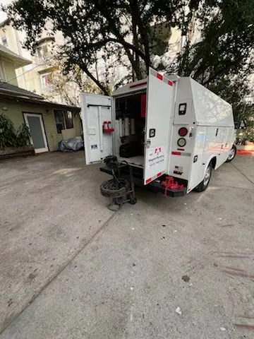 Magnet Plumbing service vehicle on-site for Grease Trap Cleaning in Boca Raton